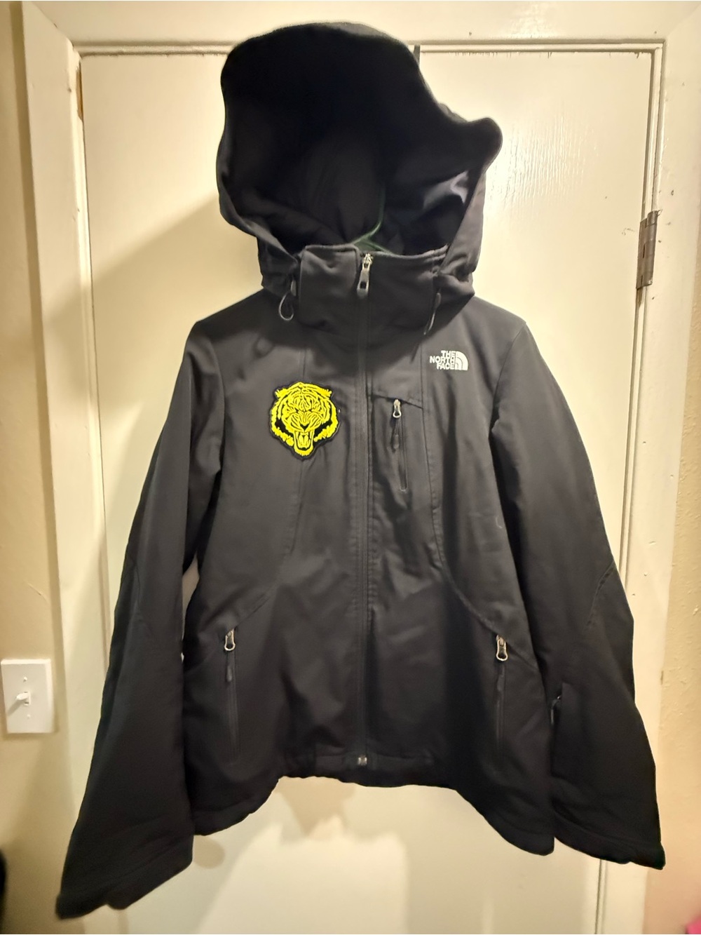 The North Face Black Hooded Rain Jacket with Yellow Tiger Patch